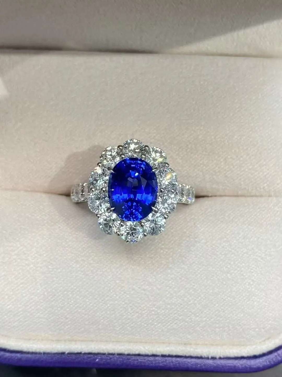 Gemformia royal blue gemstone halo ring sample surrounded by light-colored accents